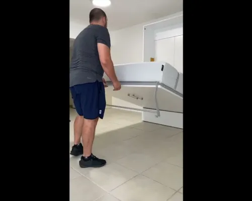 This video demonstrates a man easily unfolding and folding back up a sleek, wall-mounted Multimo Murphy bed to showcase its space-saving design.