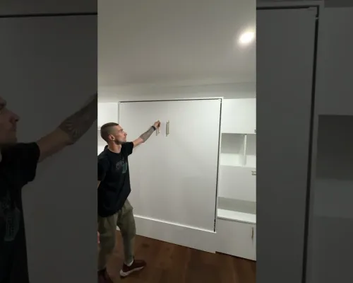 This video showcases a space-saving furniture set featuring a Queen-size loft bed, integrated bookcases, and a hidden pull-out desk.